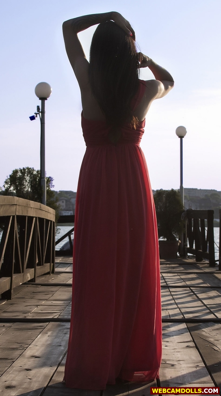 Black Haired Girl in Red Long Dress on Webcamdolls
